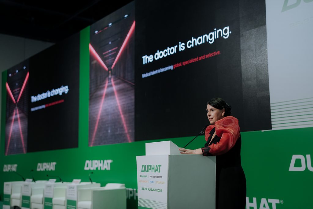 Dr. Angela Thomas delivers her keynote on healthcare workforce sustainability at DUPHAT 2026 in Dubai.